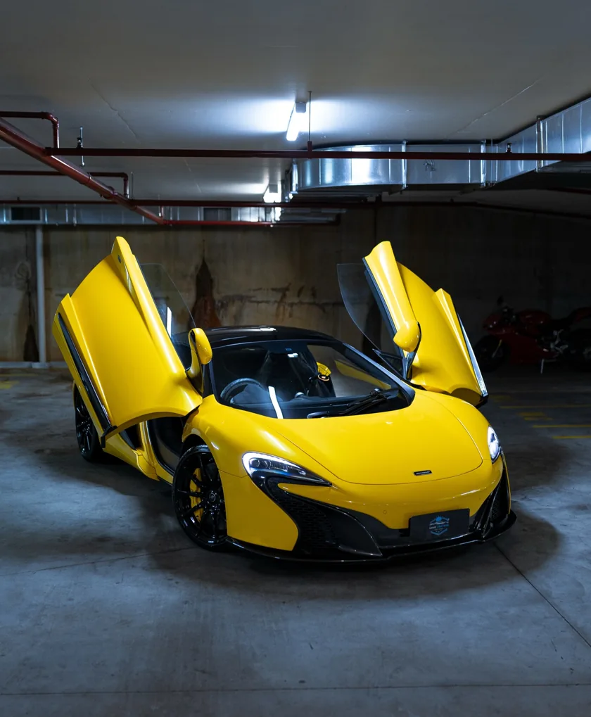 Yellow McLaren 650S with its doors open