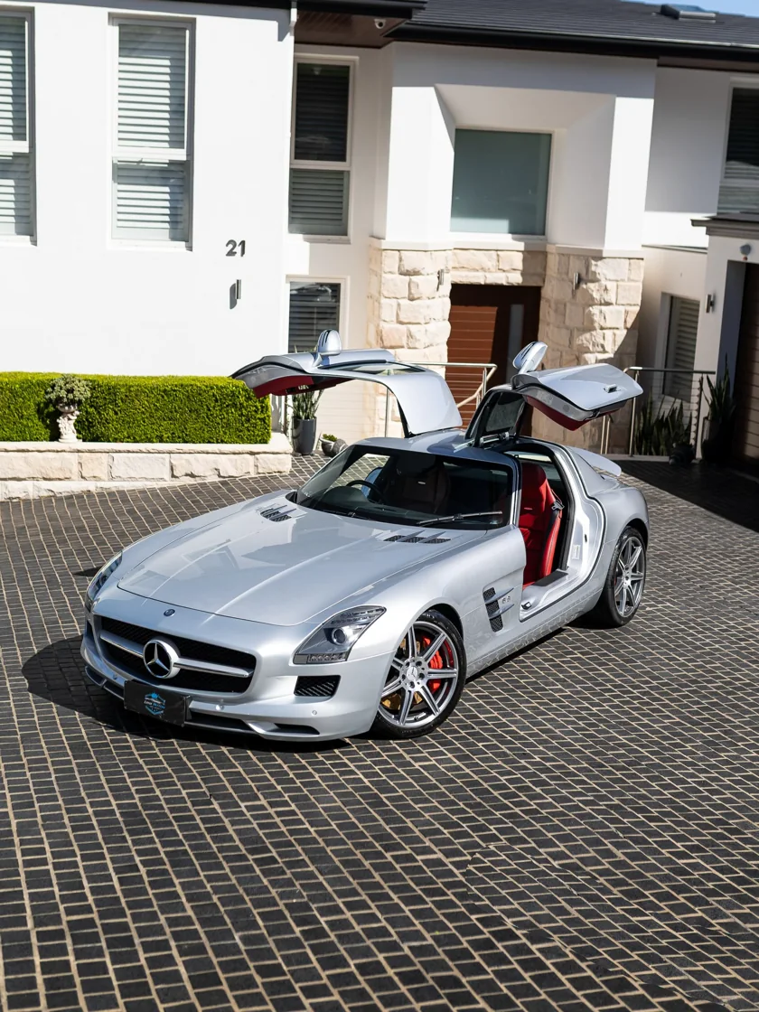 Silver Mercedes-Benz SLS AMG with gullwing doors open